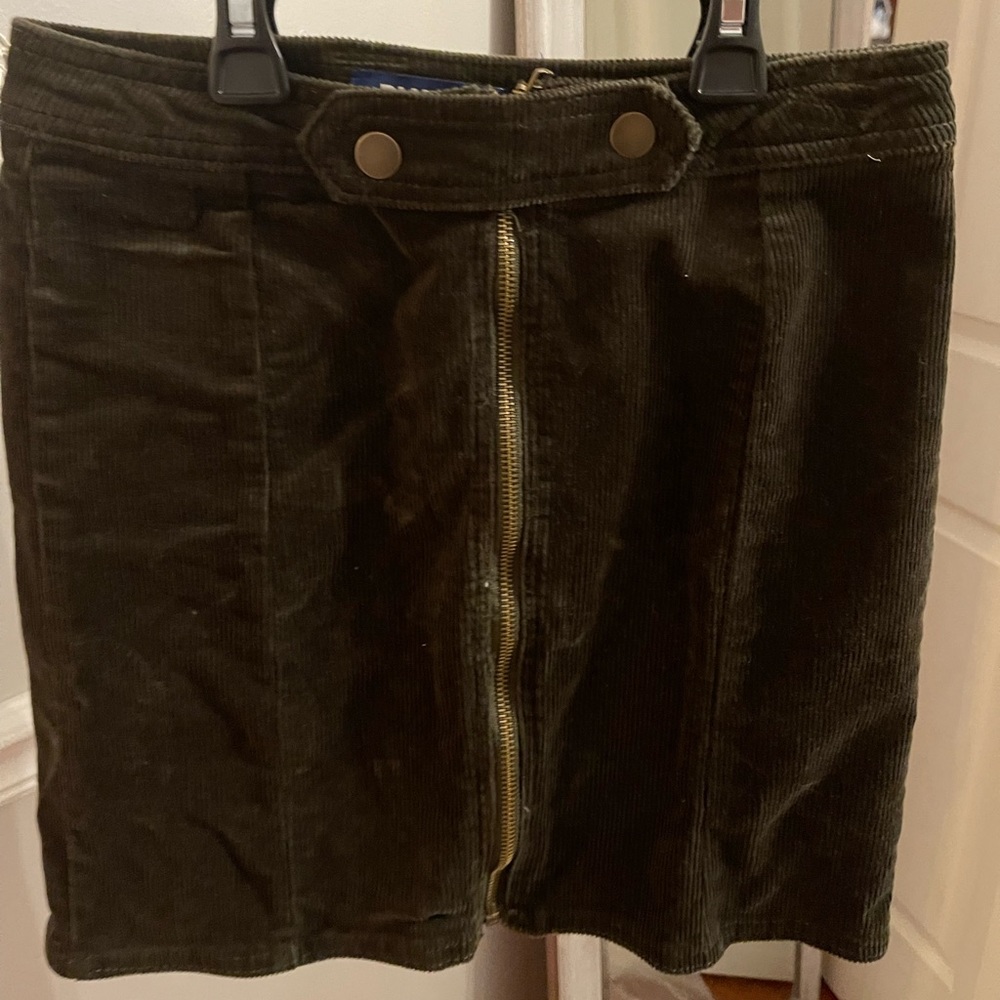 Army green corteroid mini skirt with gold detailing.